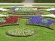 Kolisty trawnik z kwietnikami w stylu barokowym